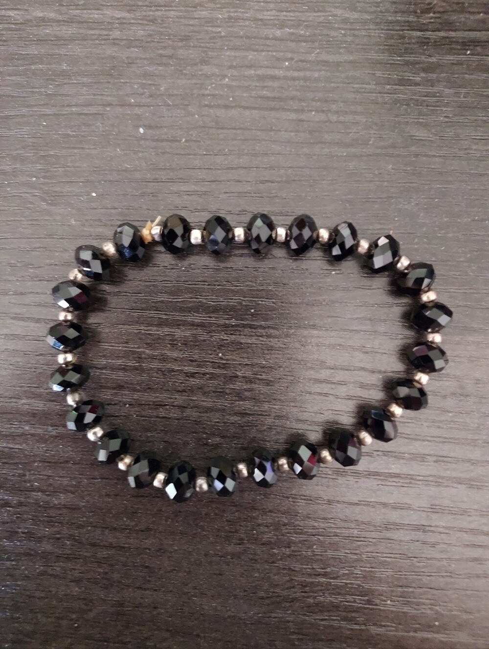 Faceted Black Bead Stretch Bracelet with Metallic Accents